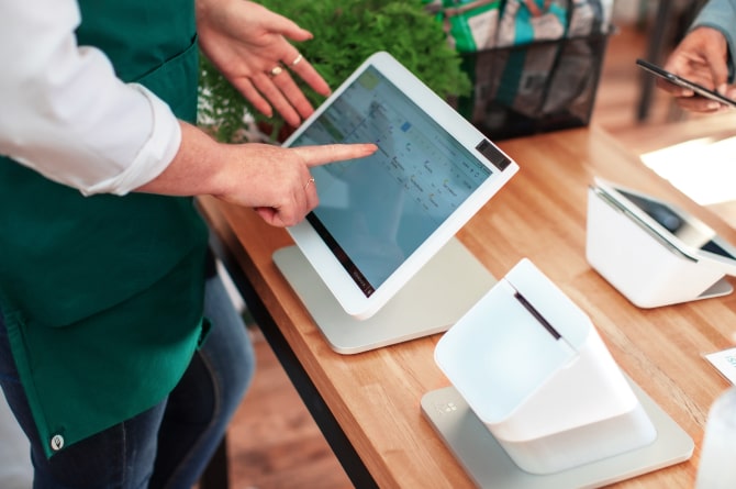 clover pos system in use on desk